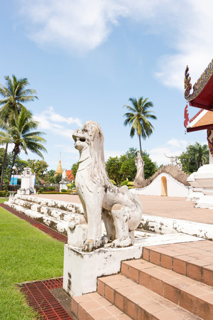 White lion sculpture in front of Ubosot Wat Phumin Nan, Thailand Side viewのeditorial素材