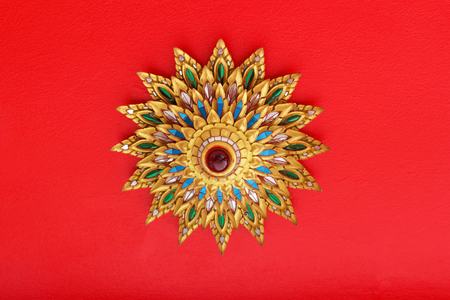 Thai ceiling light lamp on red background in thai temple.の写真素材