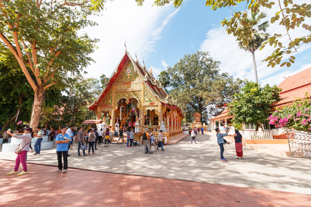 Nan, Thailand - January 1, 2016: Many tourists visit Wat Phuket for pay respect to Buddha on the New Year's Day, Wide view style.のeditorial素材