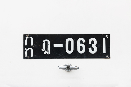 Nakhonpathom, Thailand - January 24, 2016: Old white license plate of Thailand on white car at Jesada Technik Museum.のeditorial素材