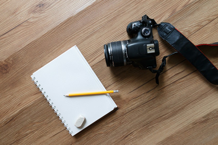 Bangkok, Thailand -  November 12, 2016: Top view of notebook and yellow pencil with Canon camera.のeditorial素材