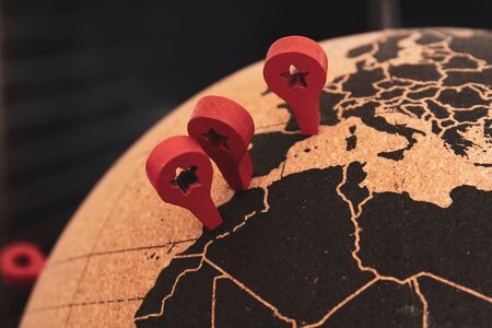 France, Spain and Morocco are pined with red markers with a hole in the shape of a star on a cork...