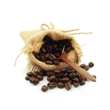 coffee beans in hemp sack bag isolated on white backgroundの写真素材