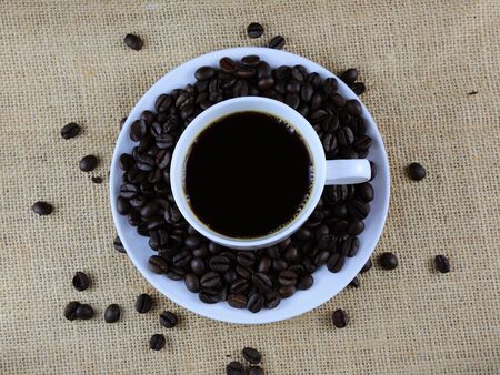 Cup of coffee on hemp sackの写真素材