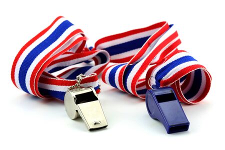 standless whistle and blue plastic whistle with Thailand national flag lanyard in heart shape on white backgroundの写真素材