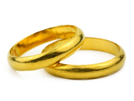 close up of Two gold rings on white background