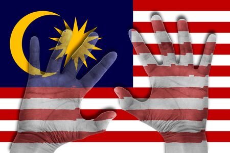 hands on malaysia flag backgroundの写真素材