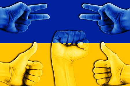 hands on Ukraine flag backgroundの写真素材