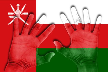 hands on oman flag backgroundの写真素材