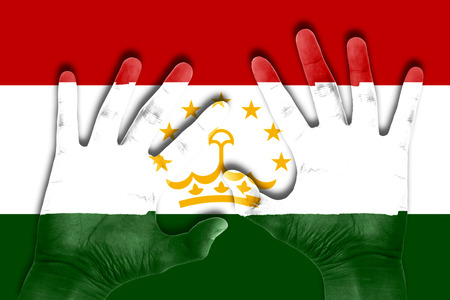 hands on tajikistan flag backgroundの写真素材