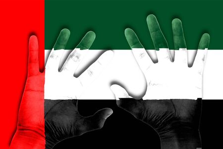 hands on united arab emirates flag backgroundの写真素材
