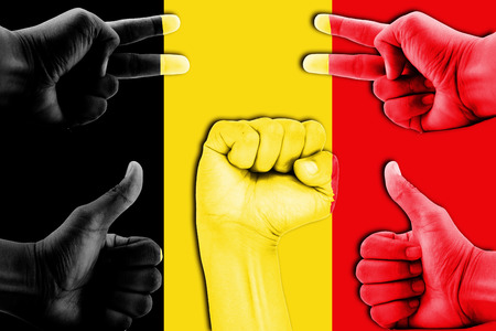 hands on Belgium flag backgroundの写真素材