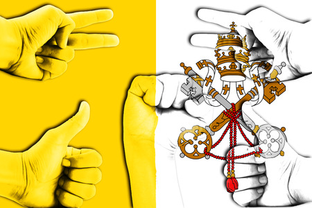 hands on Vatican City flag backgroundの写真素材