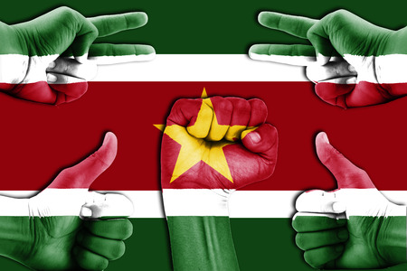 hands on Suriname flag backgroundの写真素材