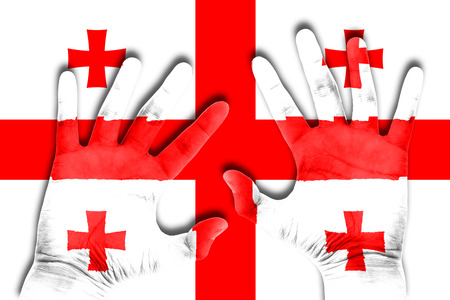 hands on georgia flag backgroundの写真素材
