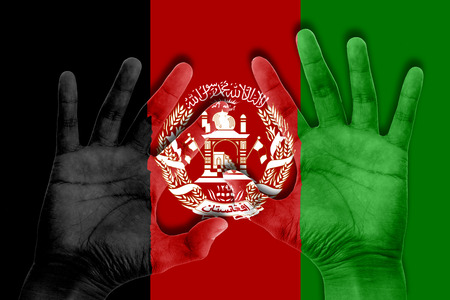 hands on afghanistan flag backgroundの写真素材