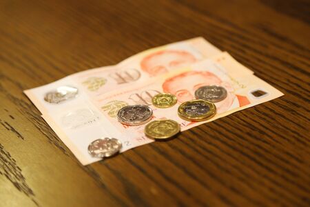 Money Singapore on the wooden for the trip to Singaporeの写真素材