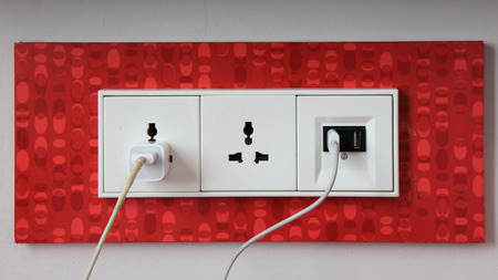 In use electrical power socket and in use usb port on the wallの写真素材