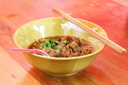 Noodles with pork with soup Thai style. Thai peoples call braised pork Noodles or Moo toonの写真素材