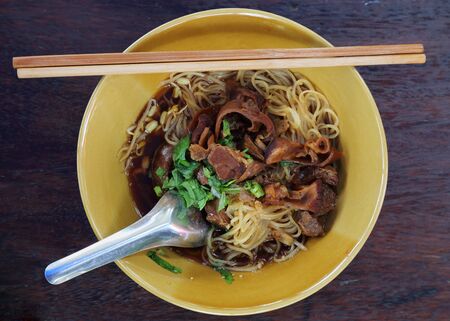 Noodles with pork with soup Thai style. Thai peoples call braised pork Noodles or Moo toonの写真素材