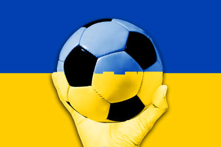Handle Ball on Ukraine flag backgroundの写真素材