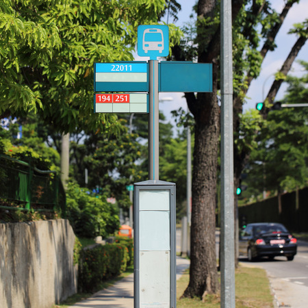 public bus stop sign on the roadの写真素材