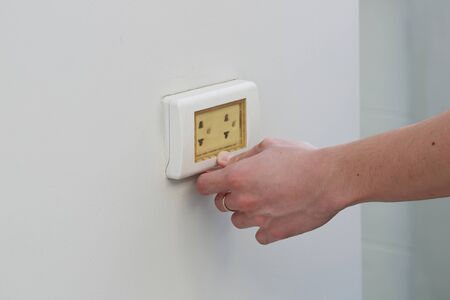hand close the Waterproof electric plugの写真素材