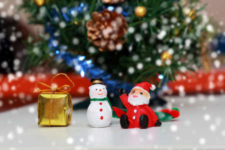 gift box, snow man and  santa clause on snow for background usageの写真素材