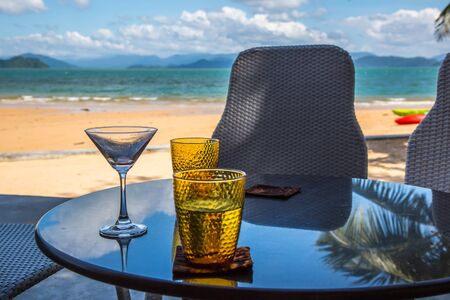 water glass put on the glass table (selective focus)の写真素材