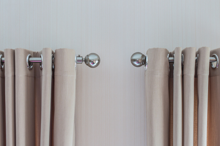 double Brown colored curtains In steel railの写真素材