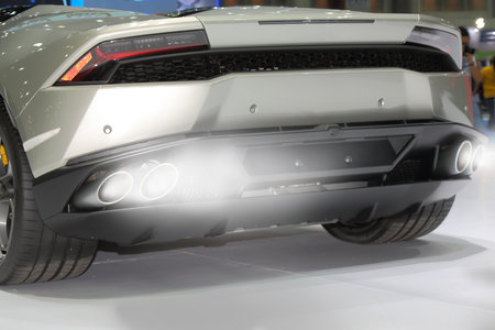 close up of Exhaust fumes pipe during starting engine of a gray sports car.のeditorial素材