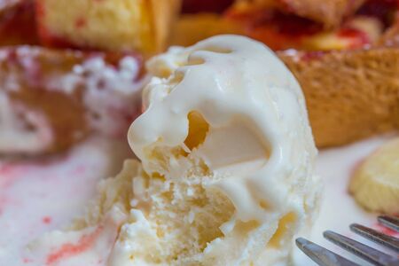 Close up of melting vanilla ice cream.の写真素材