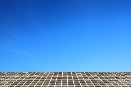 Square tile top on background of blue sky - can used for display or montage your productsの写真素材