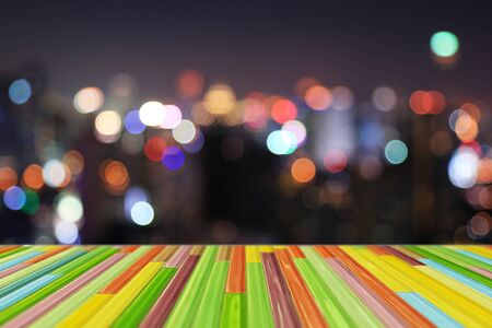 Colorful tile top on bokeh night abstract background - can used for display or montage your productsの写真素材
