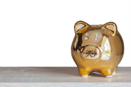 Golden piggy bank on white background, abstract background to time to start to saving or solution for keep money concept.の写真素材