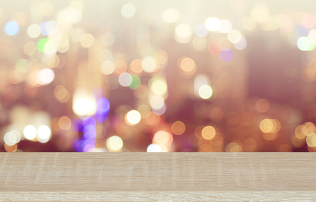 Wooden top on background of blurred vintage bokeh - can used for display or montage your products or your business.の写真素材