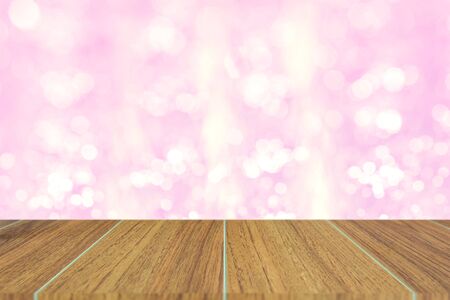 Wooden top on background of blurred soft pink bokeh - can used for display or montage your productsの写真素材