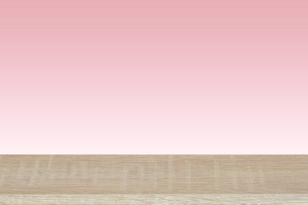 Wooden top on background of soft pink tone background - can used for display or montage your products or your business.の写真素材