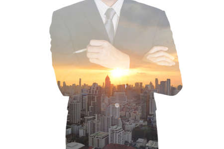 Double exposure of business man think idea, cityscape and sunset as vision of leader concept.の写真素材