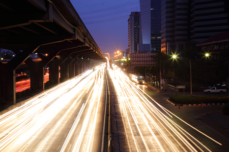 Beautiful of the light from the headlights while on the moving at the night.の写真素材