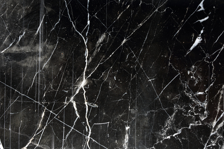 White pattern on black marble formed by nature use for background, texture and design.の写真素材
