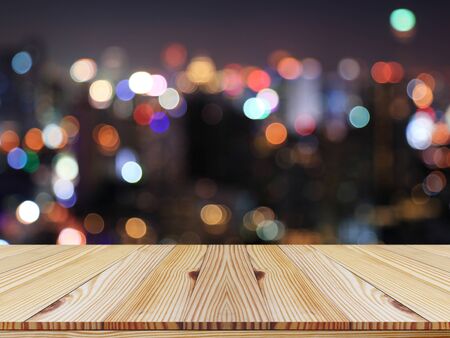 Pine wood top on colorful night bokeh background - used for display or montage products.の写真素材