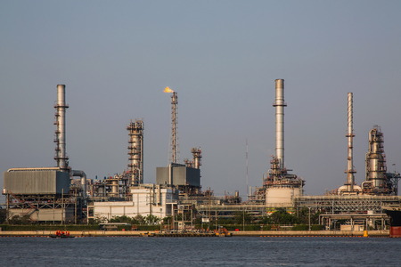 View of oil refinery industry plant at daytime and river.の写真素材
