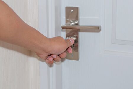 Hand-hold and lock the white door, can not be opened because use the locksmith technology.