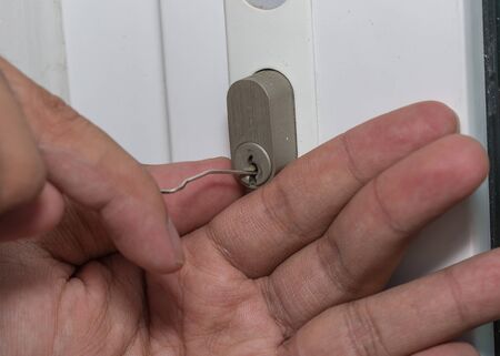 Close up of Key slot of white door to do robbery. Stealing in home.の写真素材