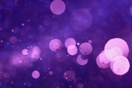Purple bokeh or violet bokeh abstract background caused by spray water.の写真素材