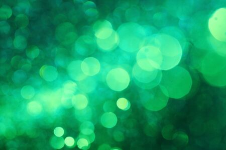 Dark green bokeh abstract background caused by spray water.の写真素材