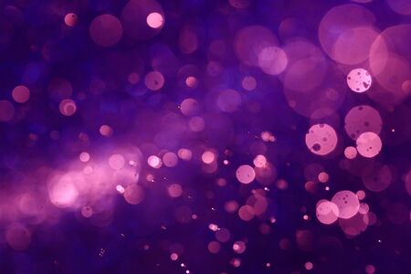 Purple bokeh abstract background caused by spray water.の写真素材