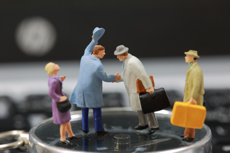 Selective focus of miniature tourist handshake as welcome and travel concept.の写真素材