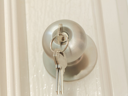 Key insert for unlock in stainless steel round ball door knob, architecture by Locksmithの写真素材